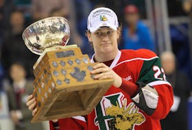 Halifax Mooseheads centre Nathan MacKinnon (#22) holds his trophy for tournamnet MVP following the team's their win over the Portland Winterhawks in the final of the Memorial Cup Canadian Junior Hockey Championship in Saskatoon, Sask, Sunday May 26, 2013.

TIM KROCHAK/ Staff