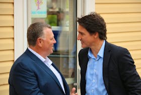 P.E.I. Premier Dennis King greets Prime Minister Justin Trudeau outside the Island Montessori Academy in Cornwall on August 21. Stu Neatby • The Guardian