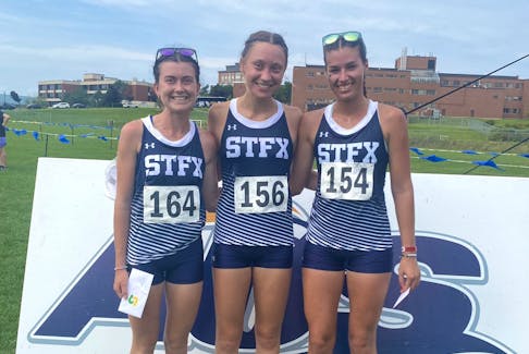 X-Women runner, from left to right, Allie Sandluck, Mairin Canning and Eileen Benoit crossed the finish line together with idential times of 32:07 to tie for first in the St. Francis Xavier Invitational in Antigonish on Saturday.