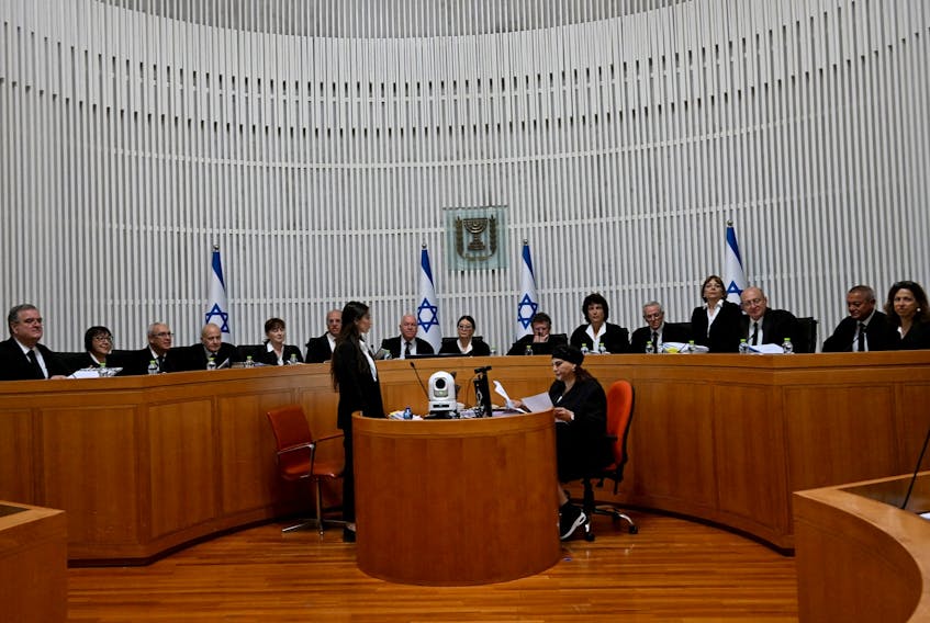 President of the Supreme Court of Israel Esther Hayut and all fifteen justices assemble to hear petitions against the reasonableness standard law in the High Court in Jerusalem, on Tuesday, September 12, 2023.    DEBBIE HILL/Pool via