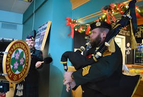 Cape Breton Highlanders Pipe and Drum Band drummer Pte. Jon Menzies and piper Major Mike MacMillan perform at the New Year's Day levee in Sydney Monday. BARB SWEET/CAPE BRETON POST