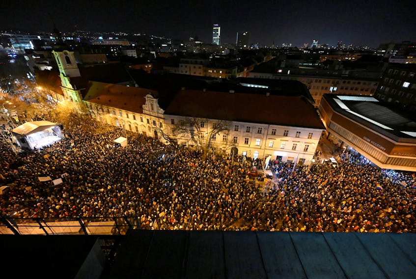 Demonstrators take part in a protest against the government's proposal to cancel a branch of prosecution which the opposition says will let serious economic crimes remain unpunished and protect government figures, in Bratislava, Slovakia, January 11, 2024.