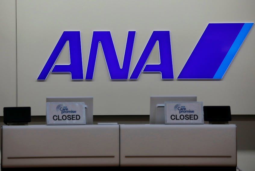The logo of All Nippon Airways (ANA) is seen on its counter amid the coronavirus disease (COVID-19) outbreak, at a terminal of the Tokyo International Airport, commonly known as Haneda Airport, in Tokyo, Japan October 27, 2020.