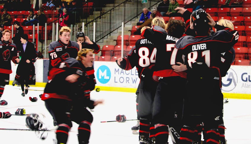 The Glace Bay Panthers celebrate after a 6-0 shutout over the Riverview Ravens on Sunday during the Blue and White Contractor Cup high school hockey tournament at the Membertou Sport and Wellness Centre. BARB SWEET/CAPE BRETON POST