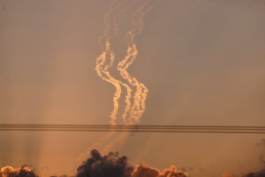 Trails of smoke are seen in the sky, amid the ongoing conflict between Israel and the Palestinian Islamist group Hamas, as seen from Israel, January 14, 2024.