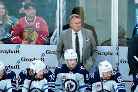 Winnipeg Jets head coach Rick Bowness stands behind the bench during the first period of a Dec. 27, 2023 game against the Chicago Blackhawks in Chicago. - David Banks-USA TODAY Sports