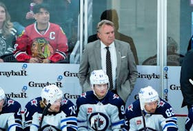 Winnipeg Jets head coach Rick Bowness stands behind the bench during the first period of a Dec. 27, 2023 game against the Chicago Blackhawks in Chicago. - David Banks-USA TODAY Sports