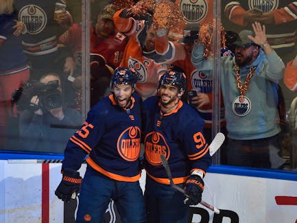 Edmonton Oilers Evander Kane (91) and Darnell Nurse (25) celebrate Kane's goal against the Calgary Flames at Rogers Place in Edmonton on May 24, 2022.