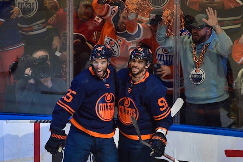 Edmonton Oilers Evander Kane (91) and Darnell Nurse (25) celebrate Kane's goal against the Calgary Flames at Rogers Place in Edmonton on May 24, 2022.