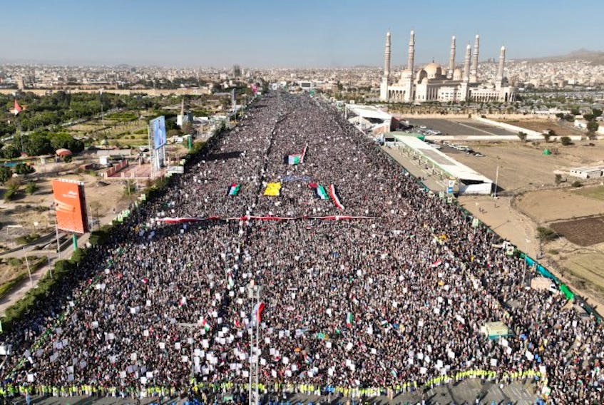 A drone view as Houthi movement supporters rally to denounce air strikes launched by the U.S. and Britain on Houthi targets, in Sanaa, Yemen January 12, 2024. Houth Media Center/Handout via