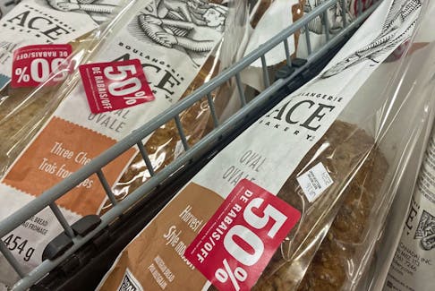 Bread sits in a cart waiting to be purchased at 50 per cent off its regular sticker price in a cart at Halifax Superstore on Monday, Jan. 15, 2024.