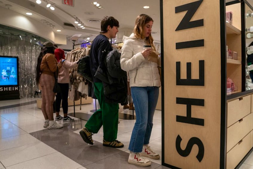 People shop at the Shein Holiday pop-up shop inside of Times Squares Forever 21 in New York City, U.S., November 10, 2023.REUTERS/David 'Dee' Delgado/File Photo