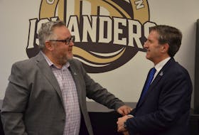 Quebec Maritimes Junior Hockey League commissioner Mario Cecchini, right, and Charlottetown Islanders interim president of operations Jason MacLean chat in the team’s offices at Eastlink Centre on Jan. 12. Cecchini, who took over the commissioner’s position last May, was in P.E.I.’s capital city for the Islanders-Rimouski Oceanic game. Jason Simmonds • The Guardian