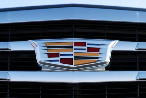 A badge of Cadillac, an automobile brand owned by General Motors Company, is seen on the grill of a vehicle for sale at a car dealership in Queens, New York, U.S., November 16, 2021.