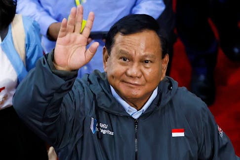 Presidential candidate Prabowo Subianto, waves to photographers as he leaves after attending a dialog held by country's anti-graft agency Corruption Eradication Commission (KPK) at its headquarters in Jakarta, Indonesia, January 17, 2024.