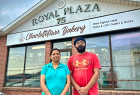 Harpreet Kaur and Amardeep Singh stand in front of their new business, Charlottetown Bakery and Café in Charlottetown. Thinh Nguyen • The Guardian
