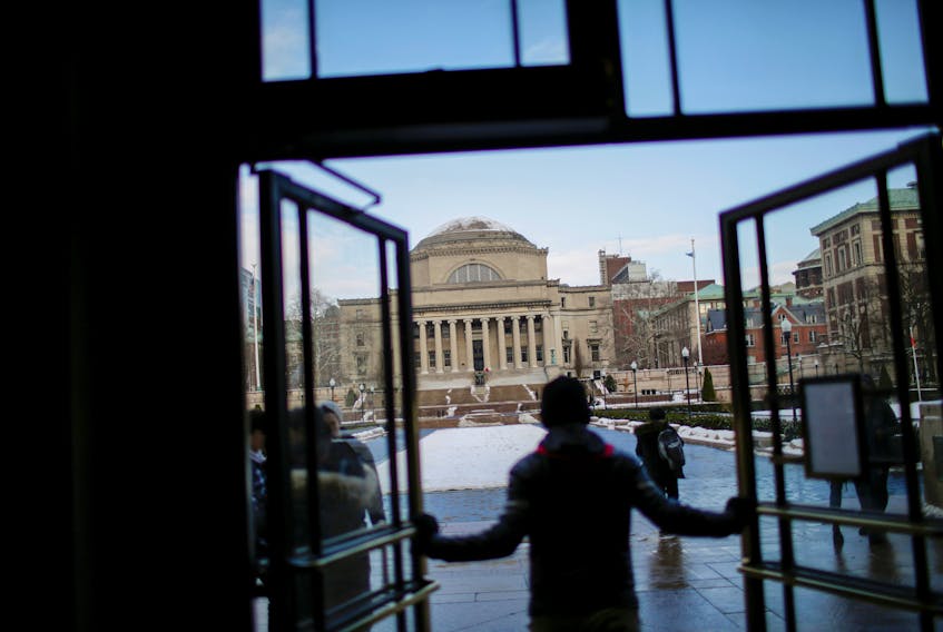 The Library of Columbia University is seen as students walk the campus in New York, U.S., December 16, 2017. 