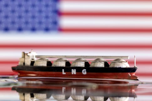 Model of LNG tanker is seen in front of the U.S. flag in this illustration taken May 19, 2022.
