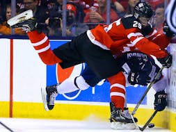 Darnell Nurse of Team Canada runs into Robert Lantosi of Team Slovakia in the semi-finals of 2015 world junior championship at the Air Canada Centre in Toronto on Jan. 4, 2015.