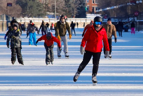 People skate on the Rideau Canal Skateway, the world's largest skating rink, during a period of subzero Arctic weather in Ottawa, Ontario, Canada January 14, 2022. 