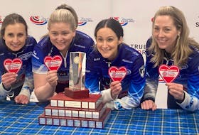 The Halifax Curling Club team of (left to right) Erin Carmody, Marie Christianson, Jill Brothers and Heather Smith celebrate their Nova Scotia Scotties Tournament of Hearts victory Sunday at their home rink. The team defeated Christina Black's two-time defending provincial championship rink 6-4. - Glenn MacDonald / The Chronicle Herald  