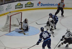 Chicoutimi Saguenéens forward Maxim Massé, 7, scores a second-period goal on Charlottetown Islanders goaltender Carter Bickle, 1, in a Quebec Maritimes Junior Hockey League (QMJHL) game at Eastlink Centre on Jan. 21. Also following the play are the Islanders’ Marcus Kearsey, 7, and Simon Duguay, 24, along with Chicoutimi’s Émile Guité, 86. Massé scored four goals in Chicoutimi’s 8-3 victory. Jason Simmonds • The Guardian