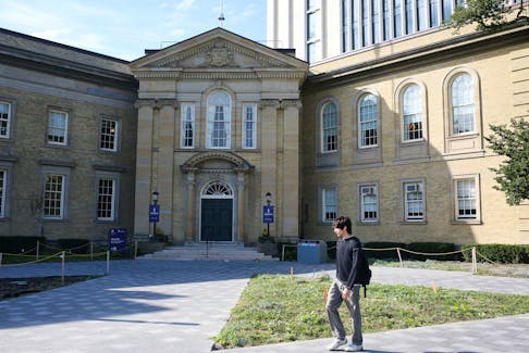 A student walks in front of the University of Toronto, St. George campus, in Toronto, Ontario, Canada September 26, 2023. 
