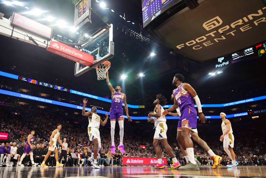 Jan 21, 2024; Phoenix, Arizona, USA; Phoenix Suns forward Kevin Durant (35) puts up a layup against the Indiana Pacers during the first half at Footprint Center. Mandatory Credit: Joe Camporeale-USA TODAY Sports