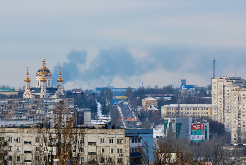Smoke from fire rises above the city in the course of Russia-Ukraine conflict in Donetsk, Russian-controlled Ukraine, January 22, 2024.