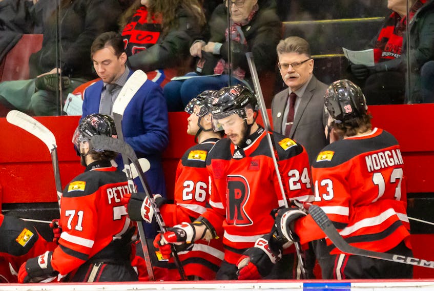 UNB Reds head coach Gardiner MacDougall, right, works the bench during an Atlantic University Sport (AUS) Men’s Hockey Conference game against the Moncton Blue Eagles in Fredericton on Jan. 19. UNB won the game 6-0. Fran Harris/For UNB Athletics
