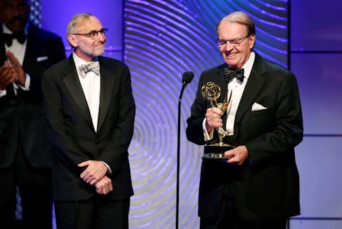 Executive producer Rand Morrison (L) and anchor Charles Osgood of "CBS Sunday Morning" accept the outstanding morning program award during the 40th annual Daytime Emmy Awards in Beverly Hills, California June 16, 2013.