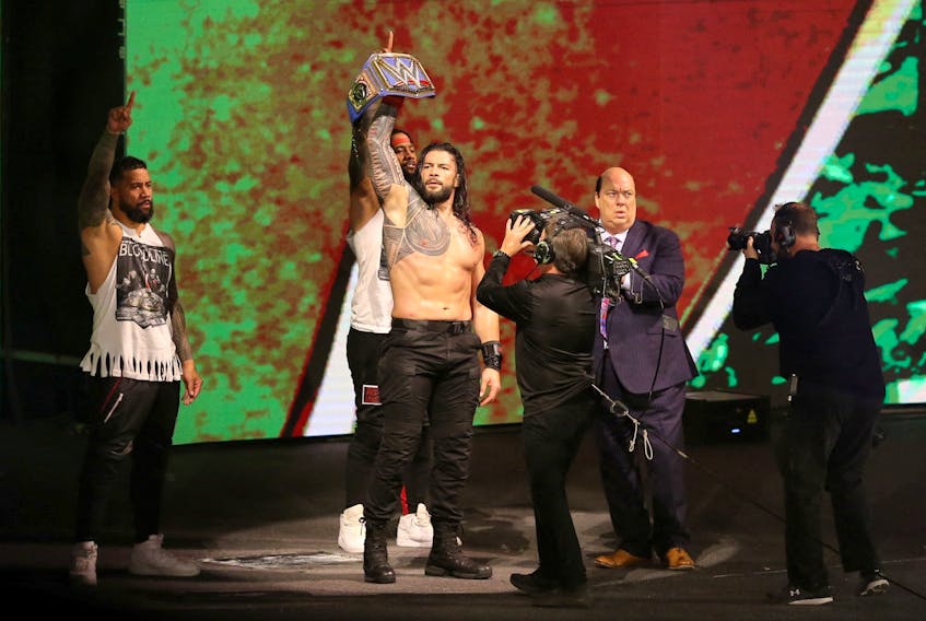 Wrestling - WWE Crown Jewel 2021 - Mohammed Abdu Arena, Riyadh, Saudi Arabia - October 21, 2021 Roman Reigns holding up his belt