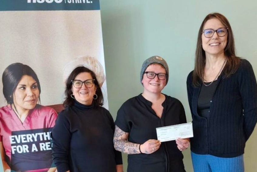 Vikki Freeman, centre, received the Livia Properties: Women in Trades award for her hard work breaking barriers in her Automotive Service and Repair Technician course at NSCC. From left: Pictou NSCC Principal, Maxine Mann, Vikki Freeman, and RCFNS executive director Penny Day.