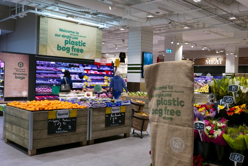 Shoppers browse a plastic bag-free Woolworths supermarket in Sydney, Australia, June 15, 2018.  