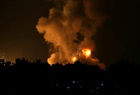 Flames rise following an Israeli air strike amid a flare-up of Israel-Palestinian violence, in the southern Gaza Strip May 10, 2021.