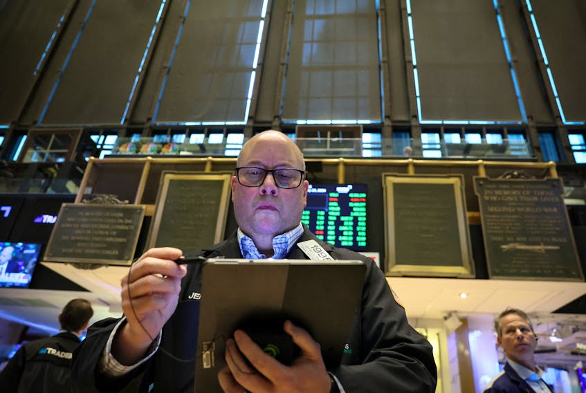 Traders work on the floor at the New York Stock Exchange (NYSE) in New York City, U.S., January 23, 2024.
