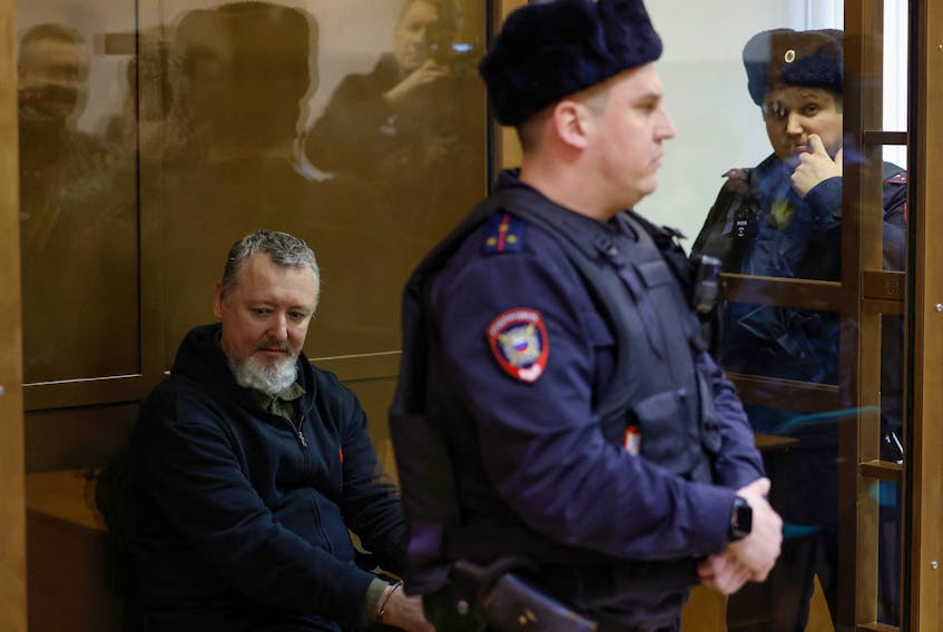 Russian prominent nationalist, former military commander and Kremlin critic Igor Girkin, also known as Igor Strelkov, who is charged with inciting extremist activity, sits behind a glass wall of an enclosure for defendants before a court hearing in Moscow, Russia, January 25, 2024.