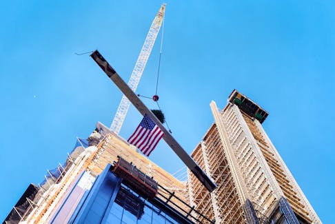 The final beam is raised during a ceremony for JPMorgan Chase's new global headquarters building at 270 Park Avenue in New York City, U.S., November 20, 2023. 