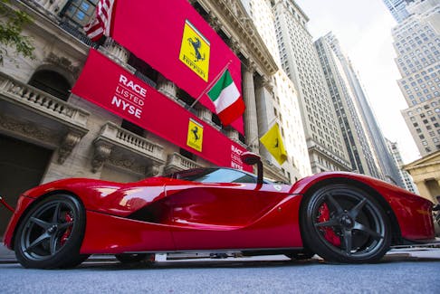A Ferrari is seen outside the New York Stock Exchange October 21, 2015.