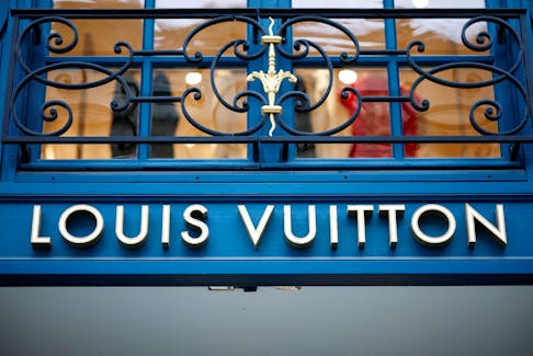 A sign on the exterior of a Louis Vuitton luxury boutique operated by LVMH Moet Hennessy Louis SE is pictured in Paris, France, January 25, 2024.