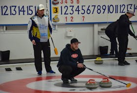 Tyler Smith, kneeling, of the Crapaud Community Curling Club calls a shot as opposing skip Darren Higgins of the host Silver Fox Entertainment Complex during the morning draw of the P.E.I. Tankard men’s curling championship on Jan. 26. Smith, the defending champion, defeated Higgins 11-6 in the A second final. Action continues Jan. 26 with draws at 2 and 7 p.m. Jason Simmonds • The Guardian