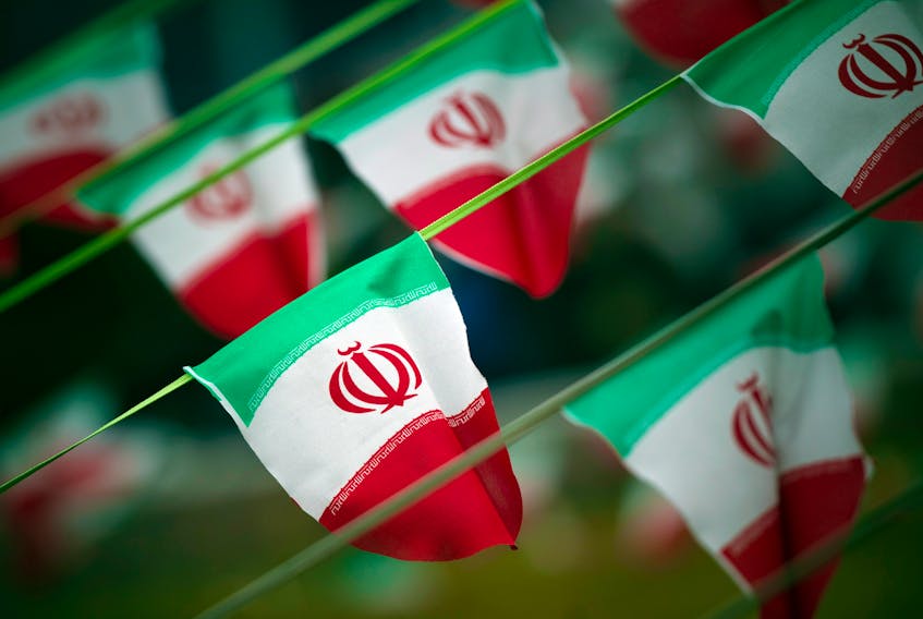 Iran's national flags are seen on a square in Tehran February 10, 2012.