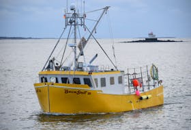 The lobster fishing boat Buck Shot III steams into the Falls Point wharf in Woods Harbour after a day on the fishing grounds. Kathy Johnson