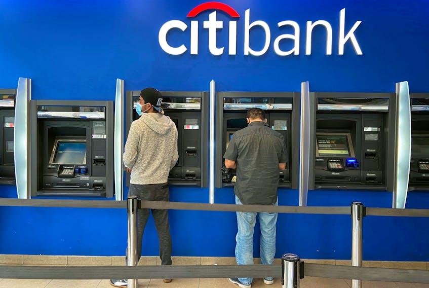 Customers use ATMs at a Citibank branch in the Jackson Heights neighborhood of the Queens borough of New York City, U.S. October 11, 2020. Picture taken October 11, 2020.