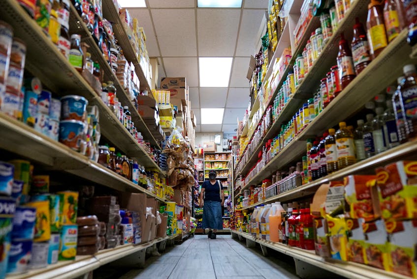 A woman shops for groceries at El Progreso Market in the Mount Pleasant neighborhood of Washington, D.C., U.S., August 19, 2022.