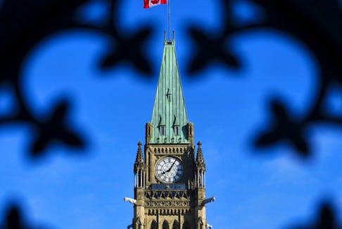 The Canada flag flies atop the Peace Tower on Parliament Hill in Ottawa on Friday, May 5, 2023.