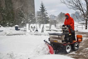 FOR STORM FOLO:
Who doesn't love winter? Snow is removed in front of a display on Alderney Drive, during some blowing snow following the first snow storm of the year in Dartmouth Monday January 29, 2024.

TIM KROCHAK PHOTO
