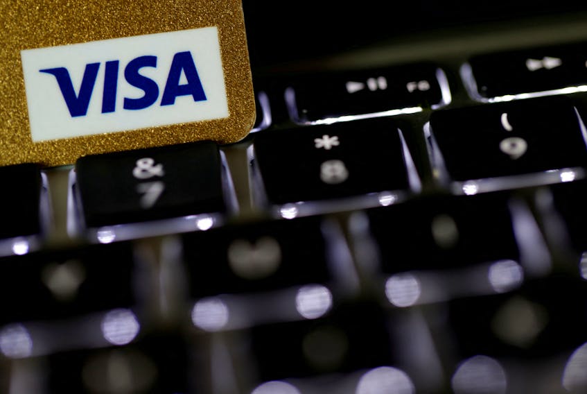 A Visa credit card is seen on a computer keyboard in this picture illustration taken September 6, 2017.