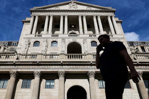 A pedestrian walks past the Bank of England in the City of London, Britain, September 25, 2023.