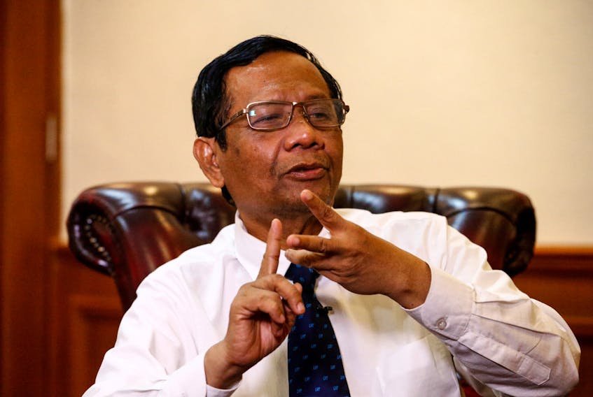 Indonesian Chief Security Minister Mohammad Mahfud MD gestures as he talks during an interview at his office in Jakarta, Indonesia, December 26, 2019.